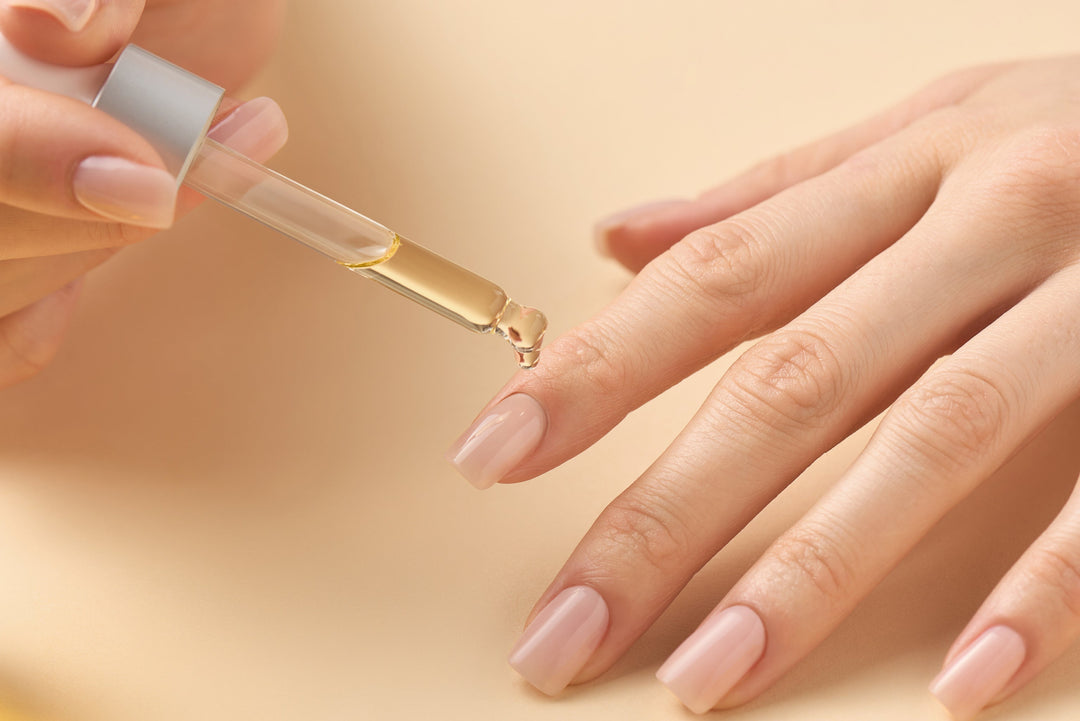 cuticle oil being applied to healthy nails