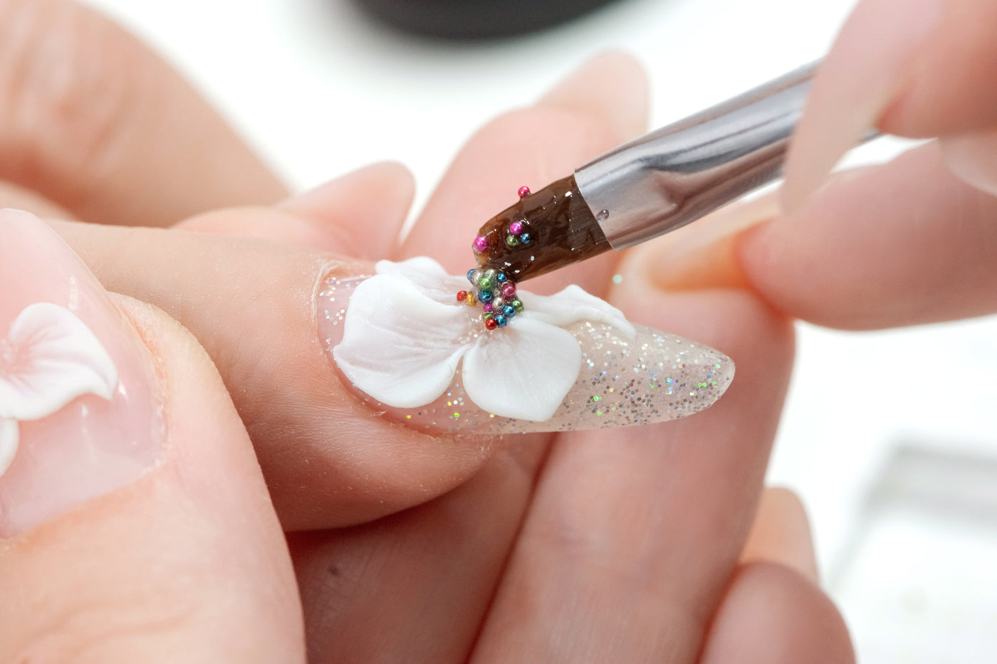 3D Nail Art being applied by a brush.