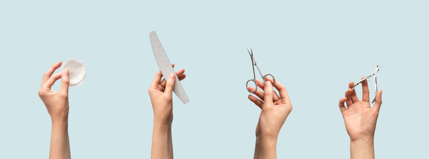 Selection of nail tools being held in the air by hands