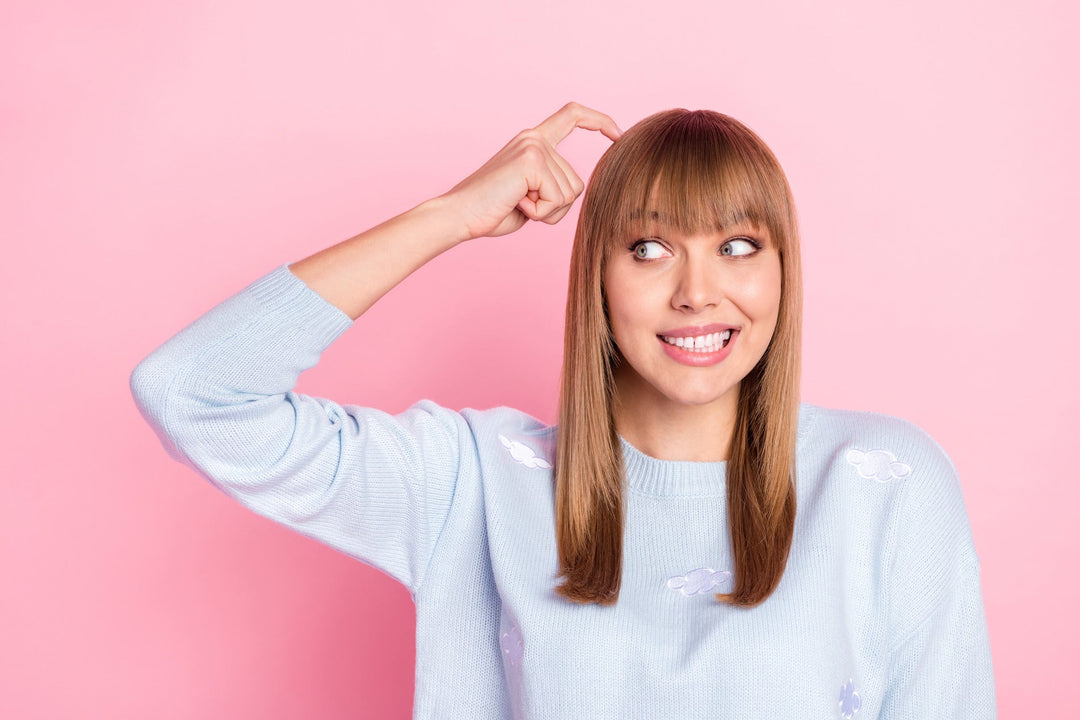Woman scratching her head as if she's confused