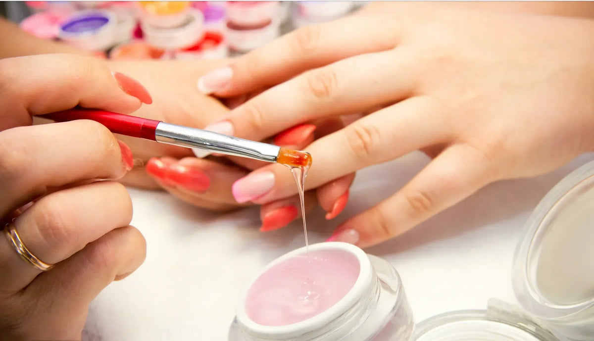 Gel being applied to a nail during a manicure