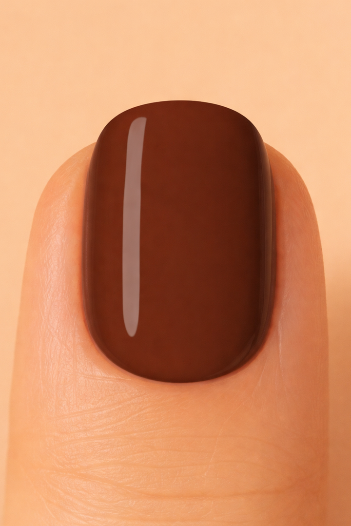 Chocolate brown colour on nail with beige background