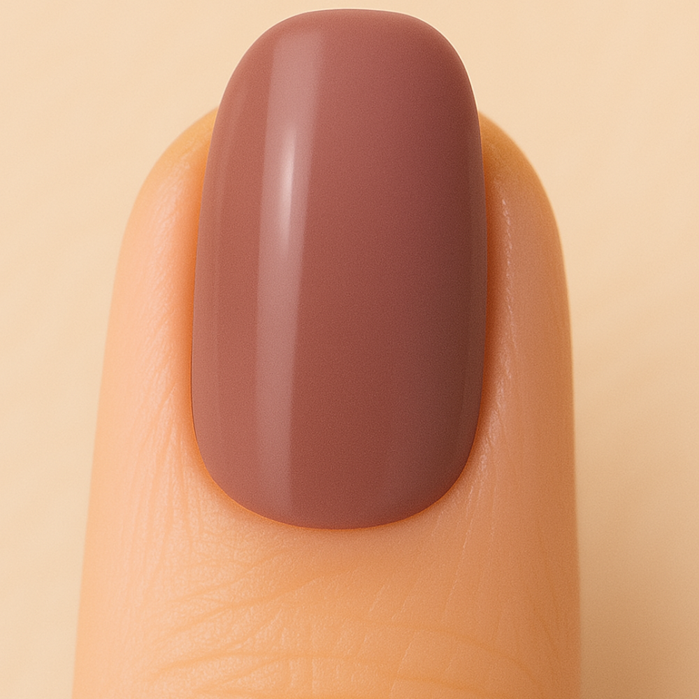 Mocha coloured gel polish on a nail