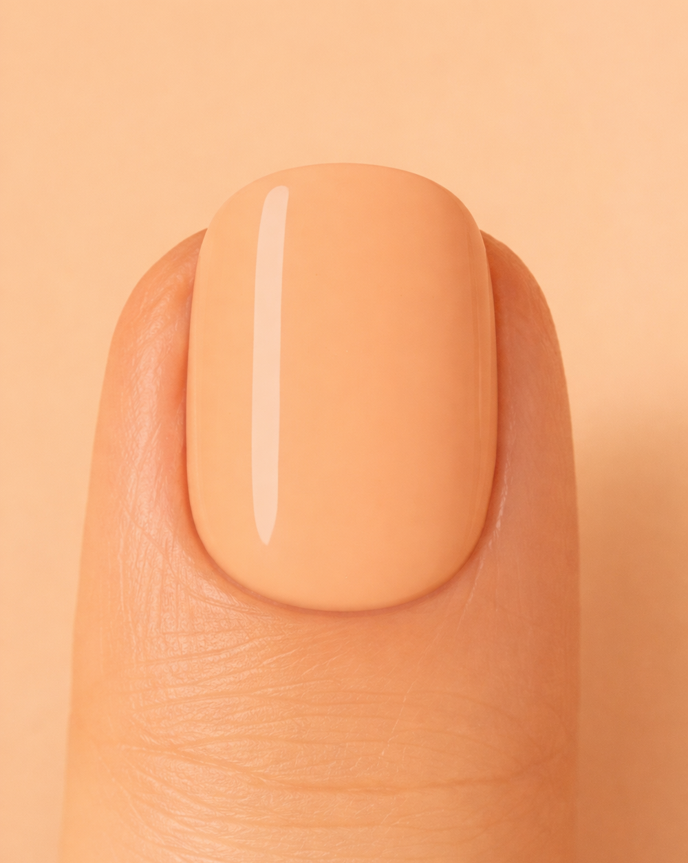 Peach nail on beige background
